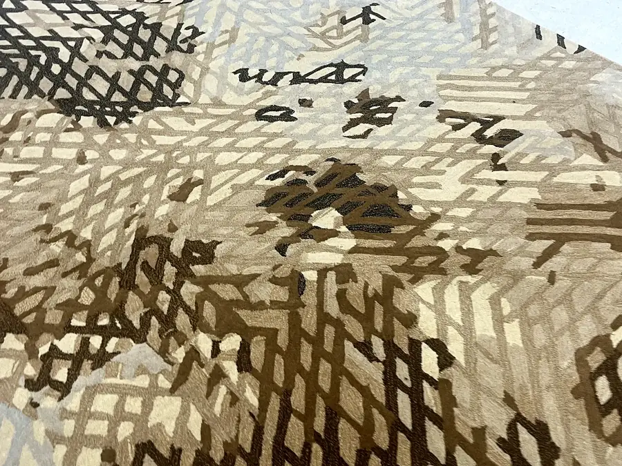 Close-up of an abstract tufted pattern in sand and brown